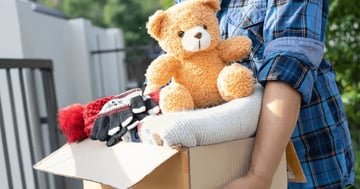 Person donating a box of items