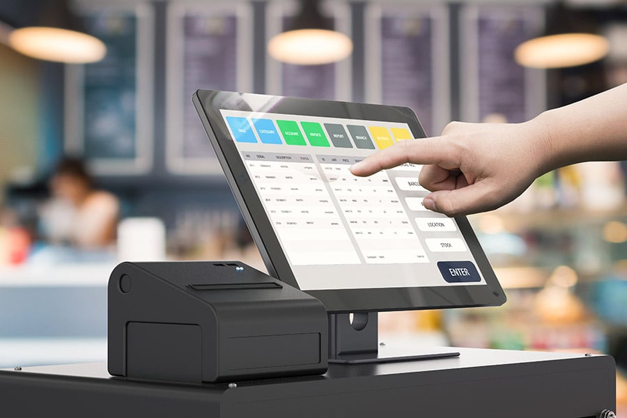 A cashier using a thrift store POS system.