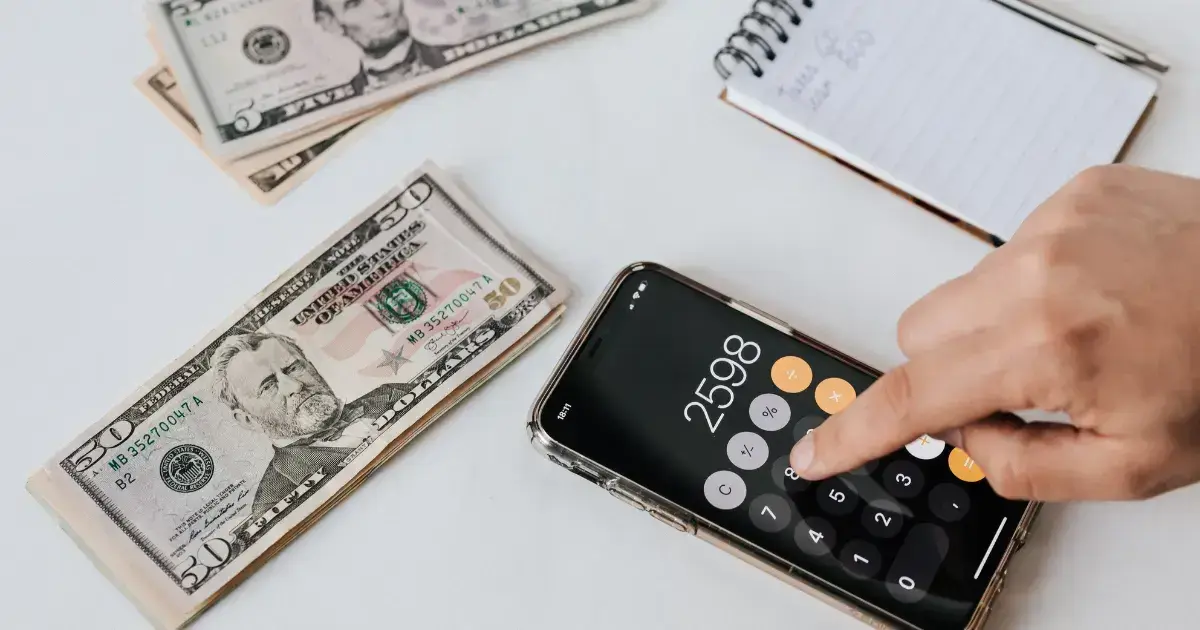 notepad, money, and calculator