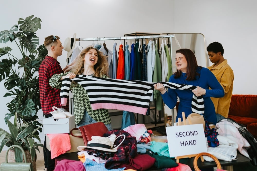 Customers play fighting over thrift clothing