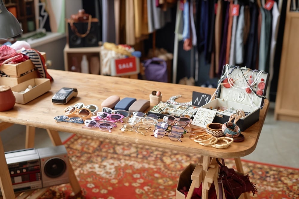 table in thrift store with items to buy