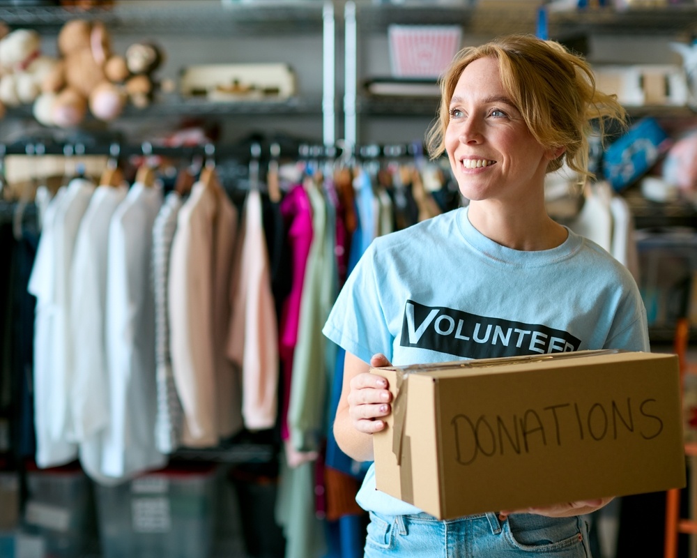 woman donating to thrift store